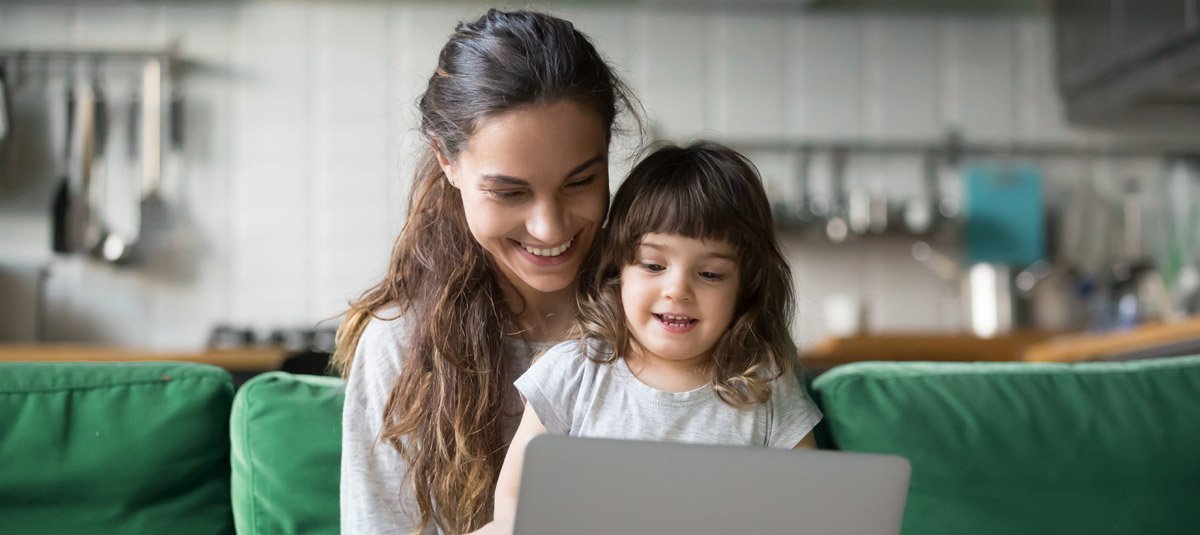 Mother daughter on laptop